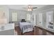 Bright bedroom featuring hardwood floors, ample natural light, and French doors at 13514 4Th E Plz, Bradenton, FL 34212