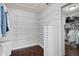 Walk-in closet featuring custom shelving for optimal storage and organization at 13514 4Th E Plz, Bradenton, FL 34212