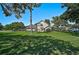 Beautiful home boasts a large manicured lawn with mature trees offering shade and curb appeal at 13514 4Th E Plz, Bradenton, FL 34212