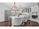 Bright kitchen with white cabinets, a marble island, stainless steel appliances, and hardwood floors at 13514 4Th E Plz, Bradenton, FL 34212