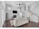 Spacious living room with a stone fireplace, high ceilings, and abundant natural light at 13514 4Th E Plz, Bradenton, FL 34212
