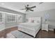 Serene primary bedroom with a bay window, hardwood floors, and neutral decor at 13514 4Th E Plz, Bradenton, FL 34212