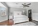 Inviting primary bedroom showcasing hardwood floors, a window seat, and white furniture at 13514 4Th E Plz, Bradenton, FL 34212