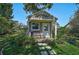 Charming shed features neutral siding and a cozy front porch, perfect for a quiet retreat or hobby space at 13514 4Th E Plz, Bradenton, FL 34212