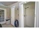 Outdoor shower with privacy curtain and convenient access from the pool area at 13514 4Th E Plz, Bradenton, FL 34212