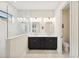 Bright bathroom features double sinks, modern vanities, and a glass enclosed shower at 13606 Deep Blue Pl, Bradenton, FL 34211