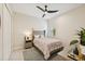 Bedroom features a ceiling fan, neutral color scheme, and natural light at 13606 Deep Blue Pl, Bradenton, FL 34211