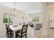 Bright dining room with an open floor plan to the living room, great lighting and plank flooring at 13606 Deep Blue Pl, Bradenton, FL 34211