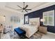 Main bedroom features a decorative wall, trey ceiling, and large windows at 13606 Deep Blue Pl, Bradenton, FL 34211
