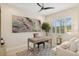 Stylish office space with neutral tones, modern art, shuttered windows and comfortable seating at 13606 Deep Blue Pl, Bradenton, FL 34211