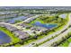 Panoramic aerial shot showcases a beautiful community with scenic lakes, lush greenery, and well-spaced homes at 16606 Barnwood Pl, Lakewood Ranch, FL 34211