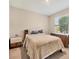 Cozy bedroom with wood furniture and plush bedding, creating a comfortable and inviting retreat at 16606 Barnwood Pl, Lakewood Ranch, FL 34211