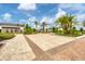 Paver entrance to the clubhouse with manicured landscaping, lush greenery, and brick accents at 16606 Barnwood Pl, Lakewood Ranch, FL 34211