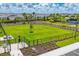 Fenced community dog park offers a safe space for pets with seating and green space at 16606 Barnwood Pl, Lakewood Ranch, FL 34211