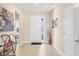 Bright foyer with tile floors, transom window in the door, and high ceilings at 16606 Barnwood Pl, Lakewood Ranch, FL 34211