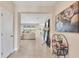 Inviting foyer with neutral tile floors and a view into the open living and dining areas at 16606 Barnwood Pl, Lakewood Ranch, FL 34211