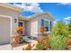 Home featuring colorful landscaping and a stone accent wall to bring the home to life at 16606 Barnwood Pl, Lakewood Ranch, FL 34211