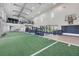 Gym area with basketball hoop, fitness machines, weights and open layout perfect for fitness enthusiasts at 16606 Barnwood Pl, Lakewood Ranch, FL 34211