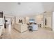 Spacious living room with tile floors, recessed lighting, and comfortable seating arrangements at 16606 Barnwood Pl, Lakewood Ranch, FL 34211