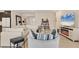 Open-plan living room with comfortable seating, a modern fireplace, and ample space for entertaining at 16606 Barnwood Pl, Lakewood Ranch, FL 34211