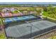Community tennis and pickleball courts with views of green spaces and neighborhood homes at 16606 Barnwood Pl, Lakewood Ranch, FL 34211