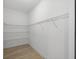 Walk-in closet with built-in shelving and rod offers ample storage space at 17113 Malta Ave, Port Charlotte, FL 33954