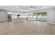 Spacious open kitchen with a large island, stainless steel appliances, and a sliding door to the backyard at 17113 Malta Ave, Port Charlotte, FL 33954