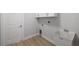 Laundry room with utility sink and cabinets at 17113 Malta Ave, Port Charlotte, FL 33954