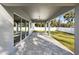 Covered patio area featuring ceiling fan and stone flooring at 17113 Malta Ave, Port Charlotte, FL 33954