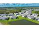Beautiful aerial view of a neighborhood with lush green spaces, scenic lakes, and modern homes at 17715 Boracay Ct # 202, Venice, FL 34293