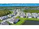 Expansive aerial view of a residential community, complete with lakes, roads, and modern homes at 17715 Boracay Ct # 202, Venice, FL 34293