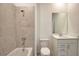 Bathroom featuring a bathtub, shower, and vanity with a sink at 17715 Boracay Ct # 202, Venice, FL 34293