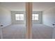 Spacious bedroom featuring carpeted flooring and windows at 17715 Boracay Ct # 202, Venice, FL 34293