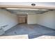 Open garage showcases its potential, clean floors and overhead lighting included at 17715 Boracay Ct # 202, Venice, FL 34293