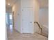 Hallway featuring tile flooring and staircase at 17715 Boracay Ct # 202, Venice, FL 34293