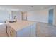 Close-up on a kitchen island featuring quartz countertops, stainless hardware, and neutral color palette at 17715 Boracay Ct # 202, Venice, FL 34293