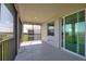 Enjoy the breeze on this screened-in lanai with views of the property and surrounding landscape at 17715 Boracay Ct # 202, Venice, FL 34293