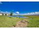 Scenic pond view with lush green landscaping, perfect for enjoying nature at 17715 Boracay Ct # 202, Venice, FL 34293