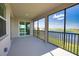 Spacious screened-in patio with views of the lake, perfect for enjoying the outdoors at 17715 Boracay Ct # 202, Venice, FL 34293