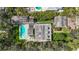 Aerial view of estate showcasing lush landscaping, pool, guest house, and privacy at 1774 Cherokee Dr, Sarasota, FL 34239
