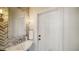 Charming half bathroom featuring modern fixtures, stylish lighting and a decorative mirror at 1774 Cherokee Dr, Sarasota, FL 34239