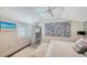 Bright bedroom with shuttered windows and an abstract art piece at 1774 Cherokee Dr, Sarasota, FL 34239