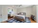 Bedroom featuring hardwood floors, a modern ceiling fan and a connected office space at 1774 Cherokee Dr, Sarasota, FL 34239