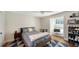 Bedroom featuring hardwood floors and a stylish blue triangle patterned rug at 1774 Cherokee Dr, Sarasota, FL 34239