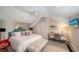 Bright bedroom featuring a plush bed, modern decor, and a mirrored vanity desk at 1774 Cherokee Dr, Sarasota, FL 34239