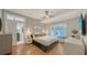 Comfortable bedroom featuring a built-in window seat, hardwood floors, and stylish decor at 1774 Cherokee Dr, Sarasota, FL 34239