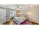 Comfortable bedroom with wood floors, pendant lighting, and built-in window seat at 1774 Cherokee Dr, Sarasota, FL 34239