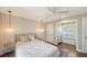 Cozy bedroom with a comfortable bed, ambient lighting, and hardwood floors at 1774 Cherokee Dr, Sarasota, FL 34239