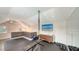 Well-equipped home gym featuring various exercise machines and a modern TV at 1774 Cherokee Dr, Sarasota, FL 34239