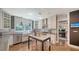 Gourmet kitchen with stainless steel appliances, marble countertops, and custom cabinetry at 1774 Cherokee Dr, Sarasota, FL 34239